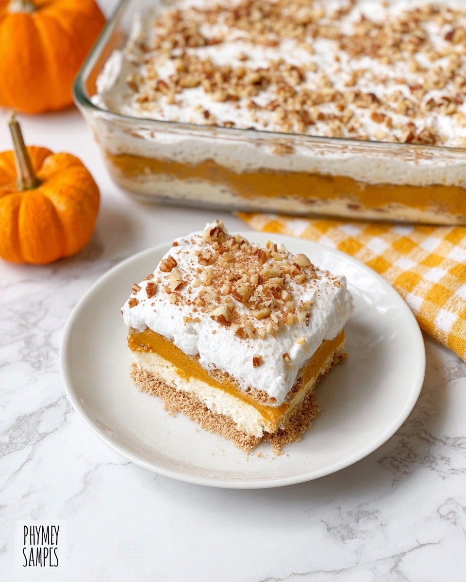 A square slice of layered pumpkin dessert sits on a white plate over a white marbled surface, showing three visible layers: a crumbly light brown base, a smooth orange pumpkin filling in the middle, and a fluffy white whipped topping sprinkled with chopped nuts on top. The larger matching dessert in a clear glass rectangular dish is visible in the background, with the same layered pattern and nuts spread evenly on the whipped cream layer. There is a yellow and white checkered cloth and a small orange pumpkin placed beside the dish. photo taken with an iphone --ar 4:5 --v 7